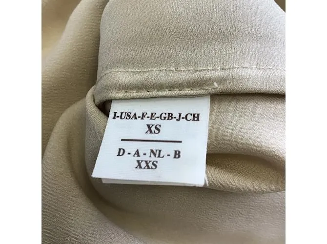 Brunello Cucinelli Vestido largo de punto con forro de seda en beige 